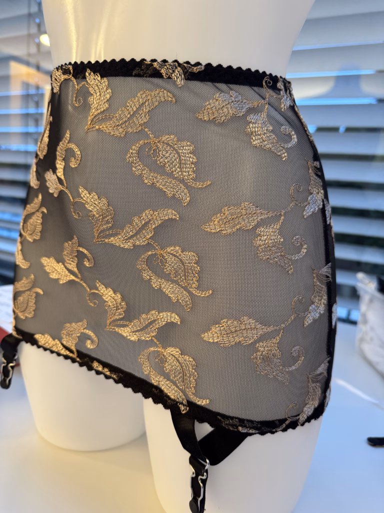 L’or Noir embroidered black mesh girdle on model Matilda